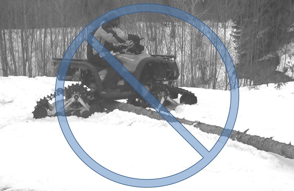 USING THE ATV WITH TRACKS Driving over an obstacle Driving over a steep ridge WARNING