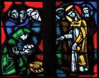 Isus razlomi kruh pa ga dade učenicima da posluže mnoštvo. Vitraj u crkvi sv. Martina, Colmar (Francuska).