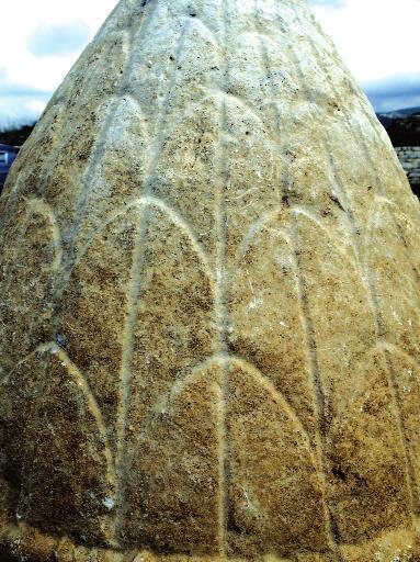 Decoration of the lower part of the cyllindrical body of a cippus Sl. 18.